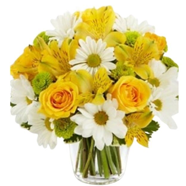 A bright mix of lilies, roses, carnations, Athos poms, daisies, and fresh greenery in a clear cube vase. It offers a compact footprint and upbeat color.